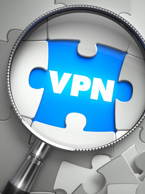 VPN - Virtual Private Network - Word on the Place of Missing Puzzle Piece through Magnifier. Selective Focus.